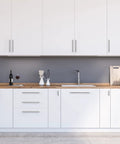 Brushed Nickel Cabinet Handles 10 Pack, Seven And One Half Inch Center To Center, Ten Inch Overall Length installed on white cabinets