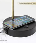 LED Desk Lamp With USB Charging Port And Flexible Swivel Arm, Sturdy Metal Construction, charging a phone on the base