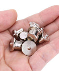 Hand holding 48 Piece Metal Dowel Center Pins Set For Pro Grade Woodworking With Four Sizes showing chromed finish and rust resistance.