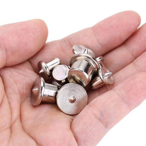 Hand holding 48 Piece Metal Dowel Center Pins Set For Pro Grade Woodworking With Four Sizes showing chromed finish and rust resistance.