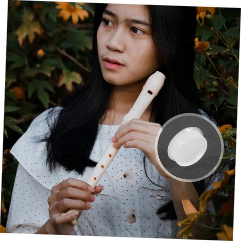 Person holding flute with Transparent Silicone Flute Plugs And Open Hole Key Caps Kit, close-up of flute plug inset.