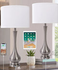 Pair Of Lit Touch Table Lamps For Bedroom And Living Room, Silver Metal Base With Fabric Shade, USB Port, 30 Inch Tall Nightstand End Table Lamps, Set Of 2, Modern Home Decor, showing USB charging use.