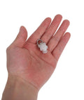 30 Pack Heavy Duty Double Wheel Curtain Track Pulleys in hand, showcasing white roller and metal hook for smooth gliding.