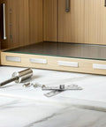 Built Tough Hidden Door Hinge Kit With Six Stainless Steel Pivot Hinges on marble surface, wooden cabinet backdrop