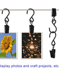 Stainless Steel S Hooks Curtain Clips 50 Pack For String Lights Photo Displays And Gutter Hangers with photos hung on them