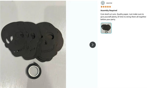 Bold Black Skull Garland Decorations For Halloween And Gothic Parties on white background with rolled adhesive tape