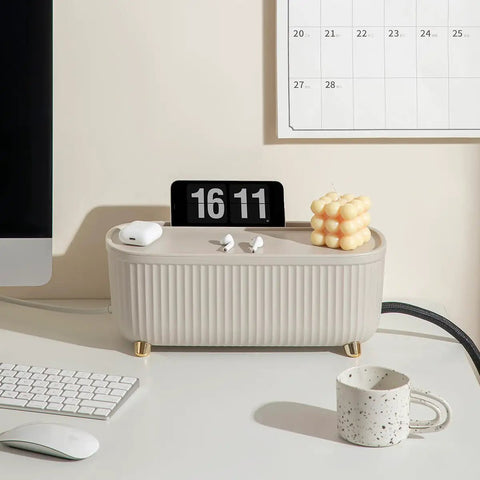 Cable Management Box Cord Organizer 13.7 By 5.9 By 5.3 Inches for TV Computer and Laptop Power Strips, light beige, on desk with items.