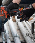 Worker using impact driver with Impact Socket Set For One Half Inch Drive Metric 12 Point Deep Sockets on metal conduit.