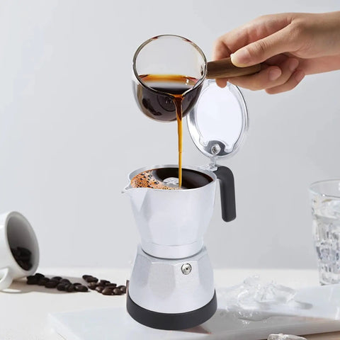 Electric Moka Pot 3 Cup Aluminum Coffee Maker With Detachable Base, Portable Italian Cuban Style Mocha Pot For Home Travel And Office, Transparent Lid Easy Brew in use with coffee being poured.