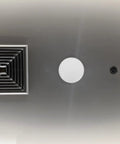 Slick Copper Fire Sprinkler Covers Decorative Escutcheon Caps installed on ceiling with ventilation grate and sprinkler head.