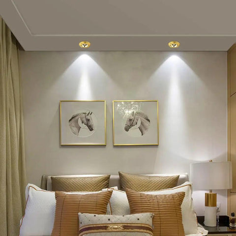12 Pack Badass Durable Brass And Copper Finish Recessed LED Ceiling Downlights Featuring Slick Baffle Trim in a modern bedroom.