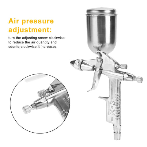 Close-up of Compact Pneumatic Spray Gun With Tight 0.5mm Nozzle And 125ml Gravity Cup showing air pressure adjustment feature.