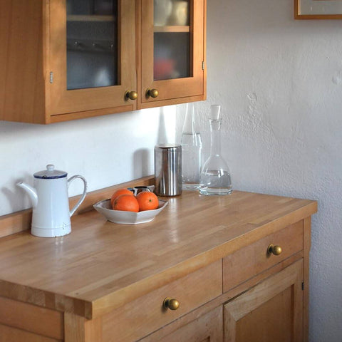 Set Of Twelve Sleek Round Antique Brass Cabinet Knobs For Rustic Modern Kitchens And Vintage Furniture Makeovers One And One Eighth Inch Diameter Durable Hardware For Cabinets Drawers And Dressers With Bold Rustic Charm on wooden kitchen cabinets.