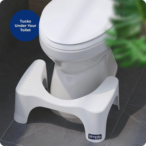 White plastic Squatty Potty Simple Curve 7-inch toilet stool beside white toilet