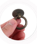 Close-up of hand holding Vintage Style Ring Pull Cabinet Handles 4 Pack Antique Bronze Drawer Pulls For Dresser Kitchen Cupboard Wardrobe Furniture Hardware With Single Hole Easy Install Durable Alloy Construction Old School Vibe