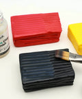 Glossy Clear Clay Sealant For Air And Polymer Clay Water Based Varnish Sealer 4.05oz 120ml shown with clay blocks and brush