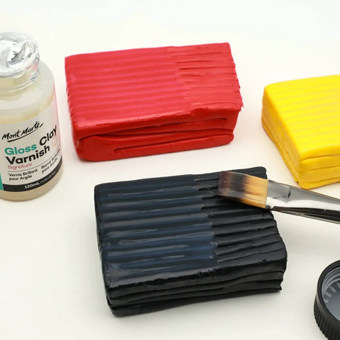 Glossy Clear Clay Sealant For Air And Polymer Clay Water Based Varnish Sealer 4.05oz 120ml shown with clay blocks and brush