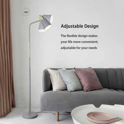 Dope Industrial Floor Lamp With Adjustable Metal Heads in a living room next to a grey sofa, showcasing its elegant design.