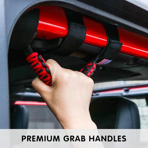 Two Pack Roll Bar Grab Handles For Jeep Wrangler Trail Ready Grip in use, showing Oxford cloth with metal buckle and paracord design