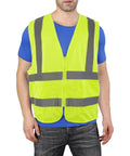 Top Shelf High Visibility Reflective Safety Vest, Fluorescent Neon Yellow, Heavy Duty Construction Work Gear With Roomy Pocket, Super Breathable Unisex Vest For Crews And Surveyors Daily on a model.