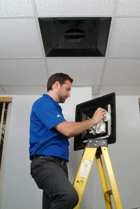 Installer placing 2x2 Foot Lay In HVAC Ceiling Diffuser With 3 Cone Supply And 10 Inch Pre Molded Boot ABS Plastic Grille in ceiling