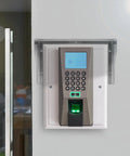 Tough As Nails Stainless Steel Doorbell Cover Plus Weatherproof Electrical Outlet Protector Shield Box For EV Charging Stations With Tool Free Install And Rust Proof Finish mounted on wall next to door.