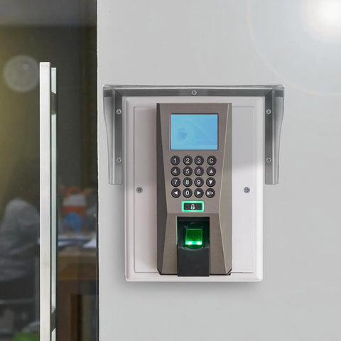 Tough As Nails Stainless Steel Doorbell Cover Plus Weatherproof Electrical Outlet Protector Shield Box For EV Charging Stations With Tool Free Install And Rust Proof Finish mounted on wall next to door.