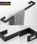 Matte Black Stainless Steel Finish 4 Piece Bathroom Accessory Set Includes 24 Inch Towel Bar, towel displayed on wall mount.