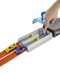 Race Case Track Set with Dual Launchers for Side by Side Racing and 1 64 Scale Cars shown with hand launching cars