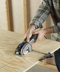 Person using Ultra Saw Corded Compact Saw Tool Kit With 3 Cutting Wheels And Auxiliary Handle for precise cuts on wood