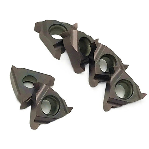 Close-up of five carbide turning inserts from the Ten Pack Of Premium Carbide Turning Inserts For CNC Metal Lathe Tool.