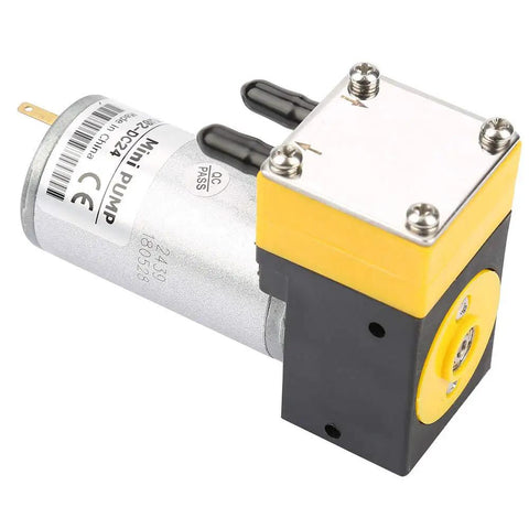 Compact Mini Diaphragm Vacuum Pump 24V DC Pulling Dead Simple Suction At One Liter Per Minute Plug And Go Setup for lab work.