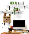 Heavy Duty Black Iron Shelf Brackets Set 20 Pack 12 Inch L Shaped Wall Mount Corner Braces For Wood Shelves Rustic Farmhouse Style Floating Shelf Supports Easy DIY Shelving For Kitchen Garage Workshop used in home office setup with plants and books on white shelves.
