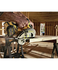Worker using Flexvolt 60V Max Cordless Circular Saw With Brake 7-1/4 Inch on wood in construction setting