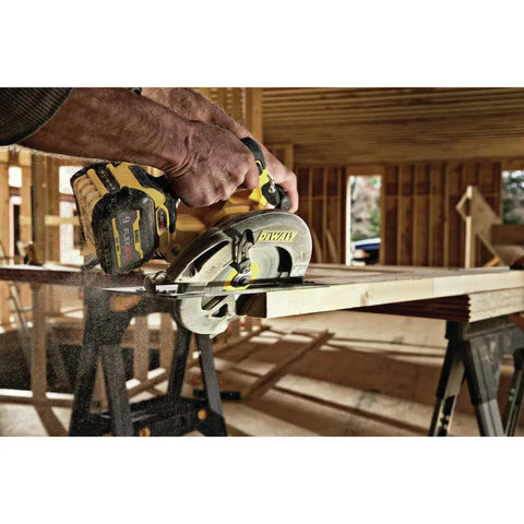 Worker using Flexvolt 60V Max Cordless Circular Saw With Brake 7-1/4 Inch on wood in construction setting