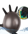 Front view of black nitrile disposable glove; inset shows a gloved hand cleaning with a sponge.