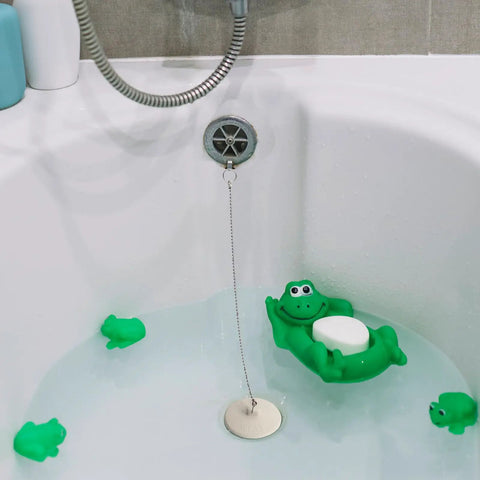 Solid 2 Pack Rubber Tub Stopper With Long Stainless Steel Beaded Chain And Heavy Duty Drain Plug For 1.5 To 2 Inch Bathroom Kitchen And Laundry Sink Drains with green frog design in bathtub.