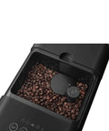 Top view of Fully Automatic Coffee Machine With Steam For Home Use Black BCC12BLMUS with coffee beans in grinder