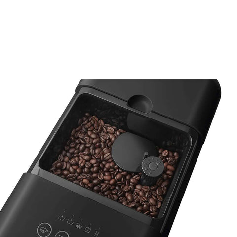 Top view of Fully Automatic Coffee Machine With Steam For Home Use Black BCC12BLMUS with coffee beans in grinder