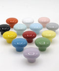 Assorted colored ceramic cabinet knobs, including green, from a 10 Pack Green Ceramic Cabinet Knobs 32mm Round Drawer Pulls With Screws.