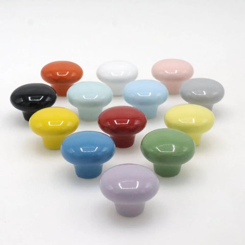 Assorted colored ceramic cabinet knobs, including green, from a 10 Pack Green Ceramic Cabinet Knobs 32mm Round Drawer Pulls With Screws.