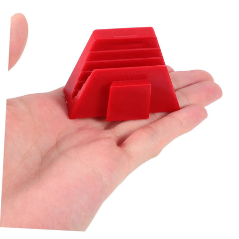 Hand holding a red plastic section of the 12 Piece Modular Wrench Organizer Tray for Garage and Workshop Durable Plastic Construction