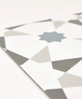 Close-up of Stellar Peel And Stick Floor Tiles Pack Of 10 White And Grey Geometric Vinyl Tiles Water Resistant And Washable 12 By 12 Inches Easy DIY Install With No Grout Or Tools Durable Vinyl For Quick Home Upgrades showing geometric pattern