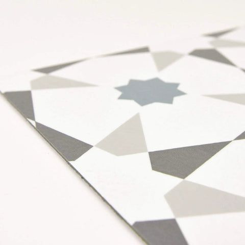 Close-up of Stellar Peel And Stick Floor Tiles Pack Of 10 White And Grey Geometric Vinyl Tiles Water Resistant And Washable 12 By 12 Inches Easy DIY Install With No Grout Or Tools Durable Vinyl For Quick Home Upgrades showing geometric pattern