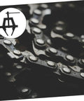 No Fuss Heavy Duty Motorcycle Chain Tensioner And Adjuster Tool crafted from solid steel against a chain background.