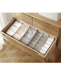 Four Piece Plastic Drawer Organizer Box With Compartment Dividers For Bras Underwear And Socks, grey bins neatly organizing clothing.