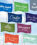 Flags featuring brand names and founding years with a label 'Our Brands' against a blue sky.