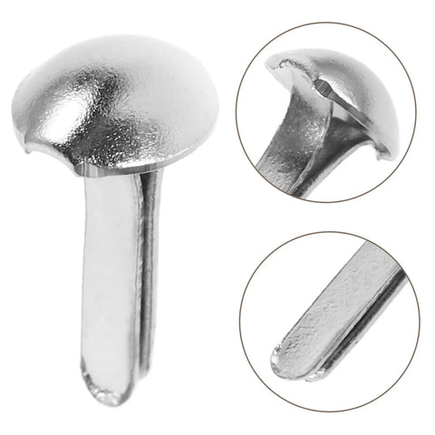 Close-up of silver split pins from 100 Piece Doll Joints Puppet Craft Kit For Kids And Grownups Scrapbook Fasteners