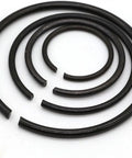 65 Count Heavy Duty Mn Steel Shaft Circlips For Axial Locking High Performance Retaining Rings arranged in various sizes on a white background.