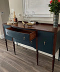 Antique sideboard with open drawer, decorated with glassware and flowers, featuring Two Pieces Brass Tear Drop Cabinet Knob Pulls in antique style.